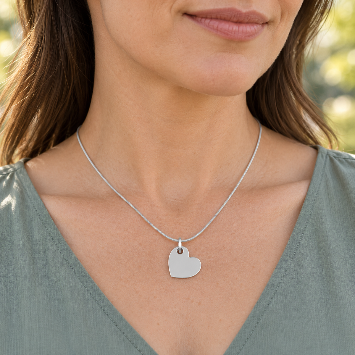 Sterling silver Angled Heart pendant worn on a matching silver snake chain