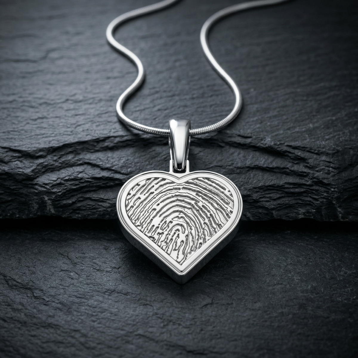 Sterling silver heart fingerprint pendant — on charcoal slate