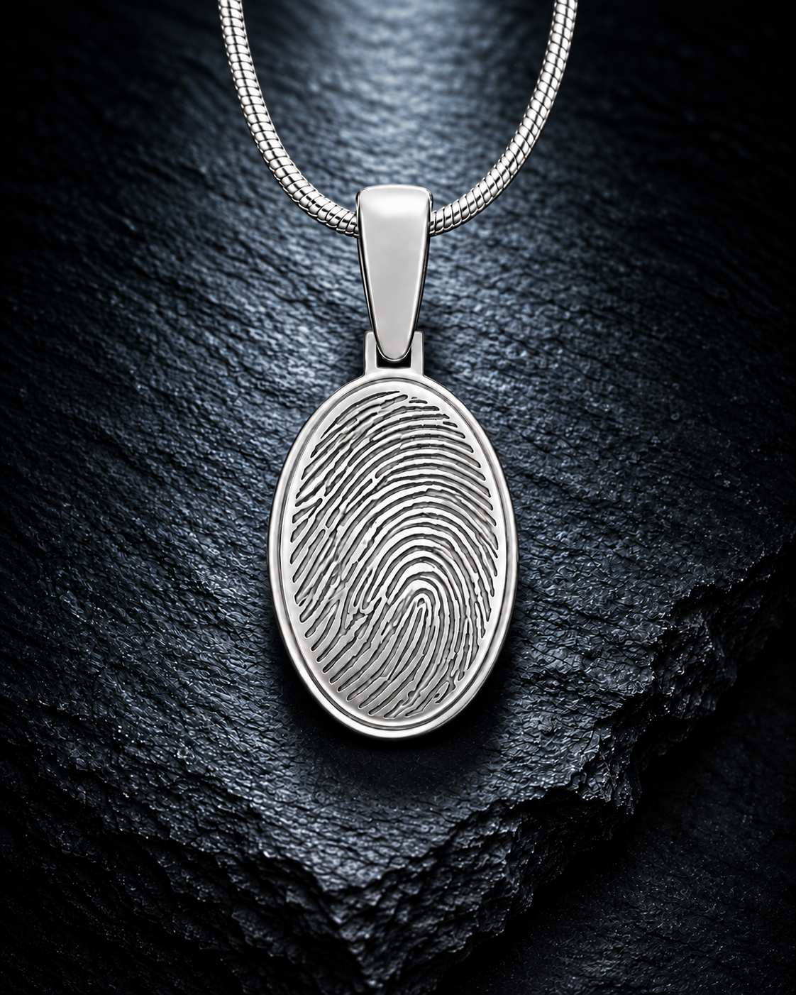 Sterling silver oval fingerprint necklace on dramatic charcoal slate