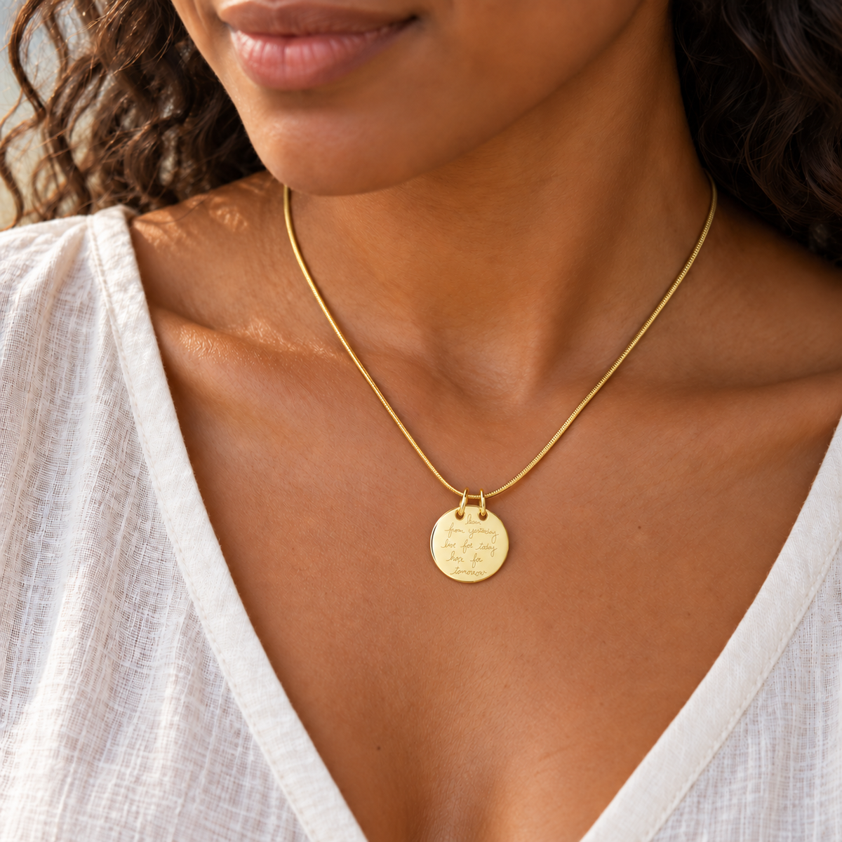 Gold Plated Ambition Permanently Sealed Waterproof Cremation Pendant worn on a matching snake chain